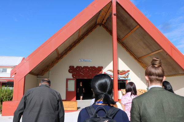 Members of the Asian Employee Network and Inclusion and Diversity team walk towards the entrance of the Papakura marae